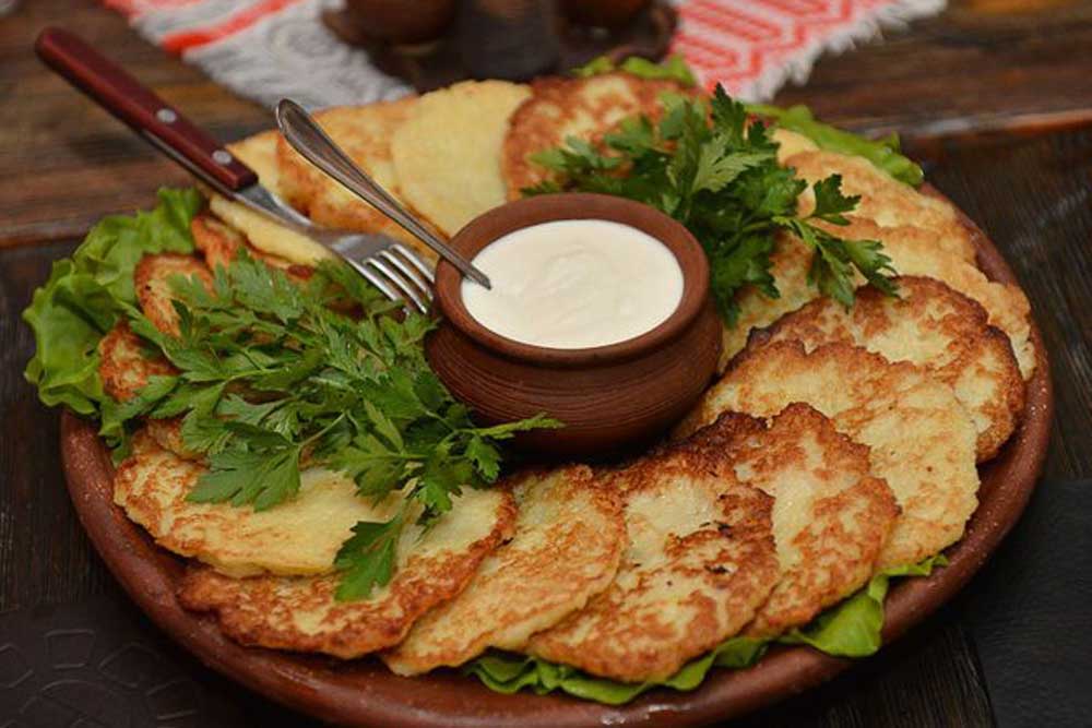 Draniki, the signature national dish made from grated potatoes