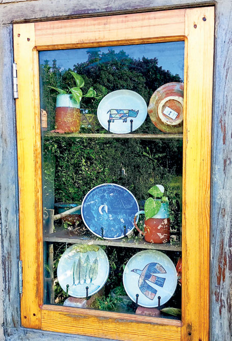 Ceramic bowls and other artefacts on display at a pottery studio