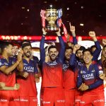 Virat Kohli of Royal Challengers Bengaluru lifts the IPL trophy alongside teammates following the team's victory in the 2025 IPL Final match between Royal Challengers Bengaluru and Punjab Kings at Narendra Modi Stadium, Ahmedabad, June 3, 2025