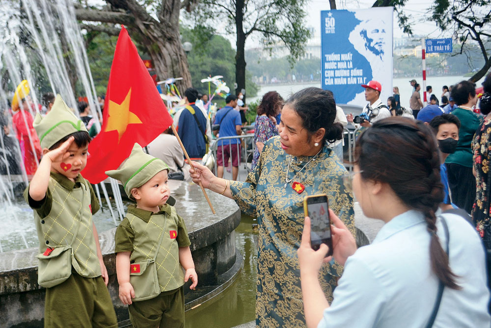 Children dressed up in military uniform, Hanoi