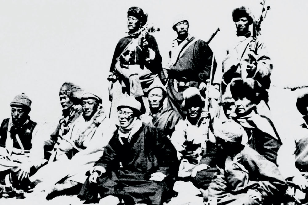 The Dalai Lama and his warrior escort rest in the Himalayas en route to India from Lhasa, March 1959