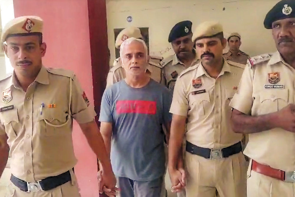 Deepak Yadav being brought to a Gurugram court, July 11, 2025