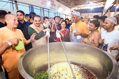 Chairman of Adani Group Gautam Adani and Chairperson of Adani Foundation Dr Priti Adani stir up a seva meal for pilgrims at the ISKCON-Adani mega kitchen in Puri, Odisha, June 27, 2025