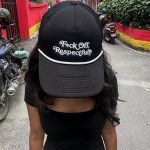 Tanuja Pandey displays a message on her cap for her detractors and a section of the media that she says is peddling falsehoods about her